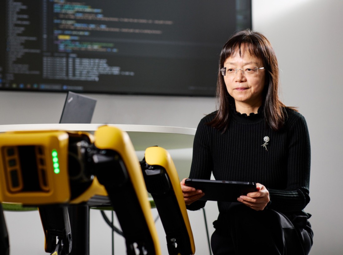 Professor Liangxiu Han conducting research in a laboratory