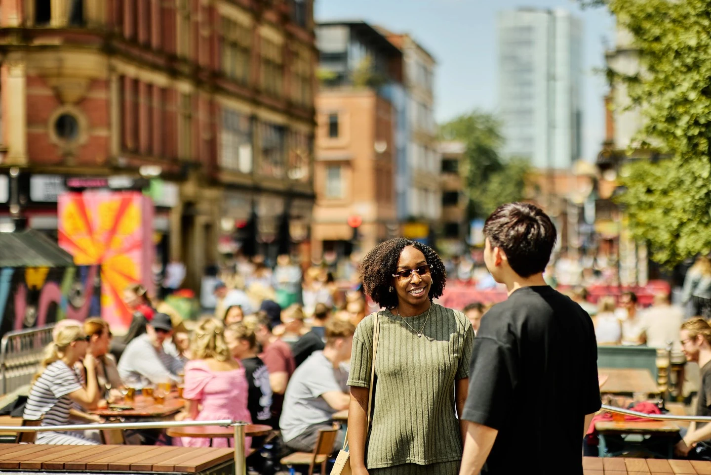 two people stood in stevenson square chatting