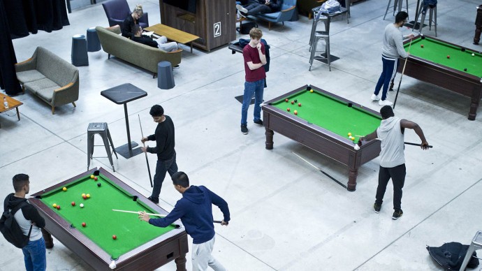 Students playing ping pong and pool