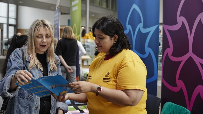 Prospective student and volunteer talking at undergraduate open day
