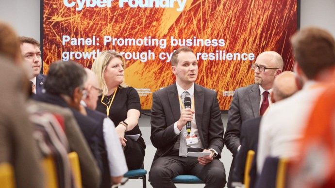 A presenter speaking at a Greater Manchester Cyber Foundry event