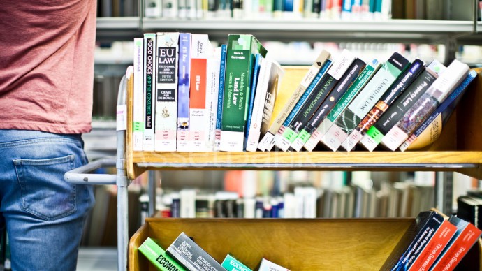 A cart of books within a library