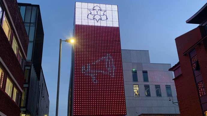 SODA building lit up with Carer's Rights Day logo