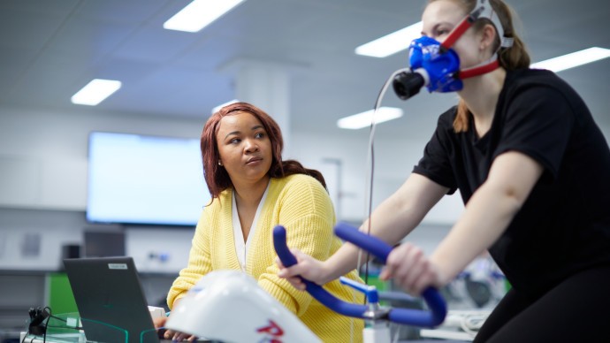 Postgraduate researcher conducting a cardiopulmonary bike test 