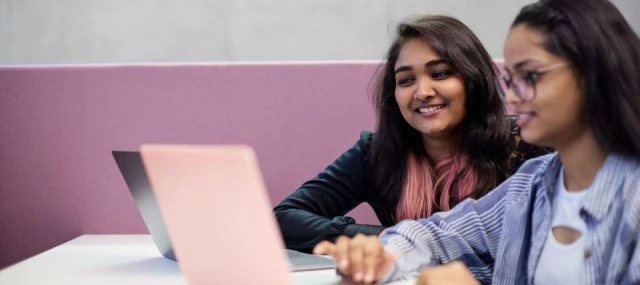 Group of students working on laptops