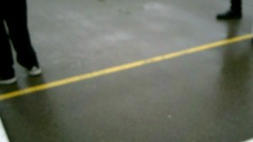 blurred image of playground surface and childrens feet
