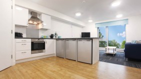 Ropemaker Court Kitchen with fridge, freezer, washing machine, oven, cupboards and sofa area