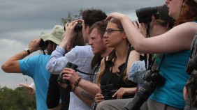 People looking through binoculars 