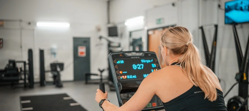 student on bike at the gym